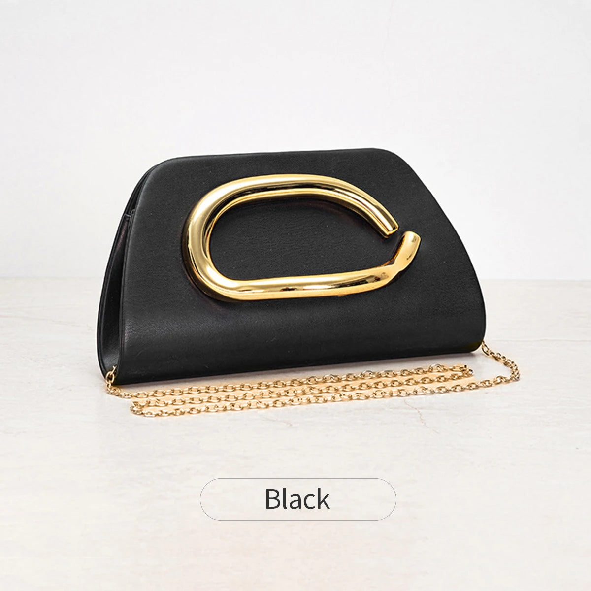 Bolso Aurelia | Clutch tipo caja con cierre metálico dorado y cadena desmontable para eventos elegantes